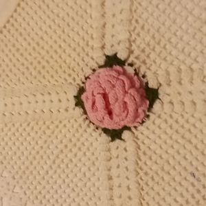Pillow cases one set, vintage looking knitted o one side with a rose in the cent